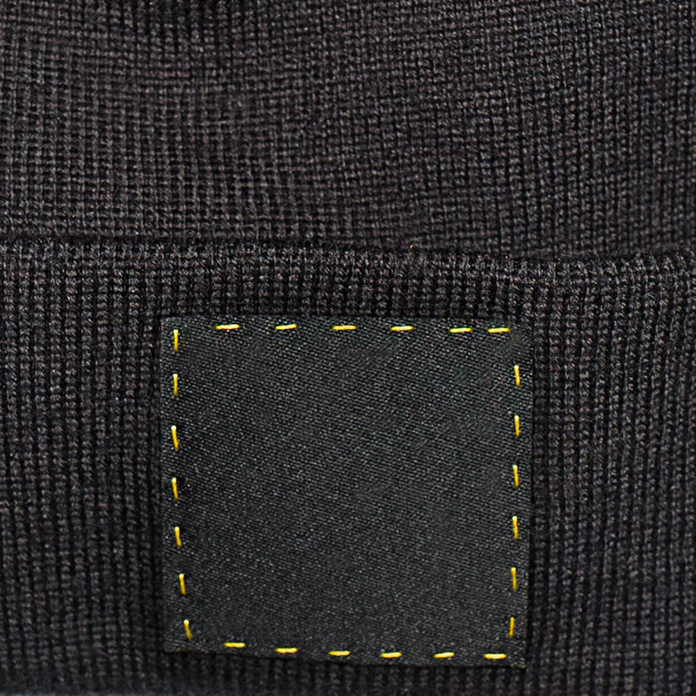 Close-up of the Square stitched on åäö’s Beanie, showcasing precise craftsmanship and attention to detail
