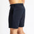 Rear view of a man in The Shorts by åäö in Deep Blue, highlighting their perfected fit and timeless design.