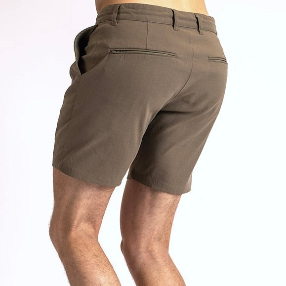 Rear view of a man in the Shorts by åäö in Dusty Desert, showcasing their timeless design.