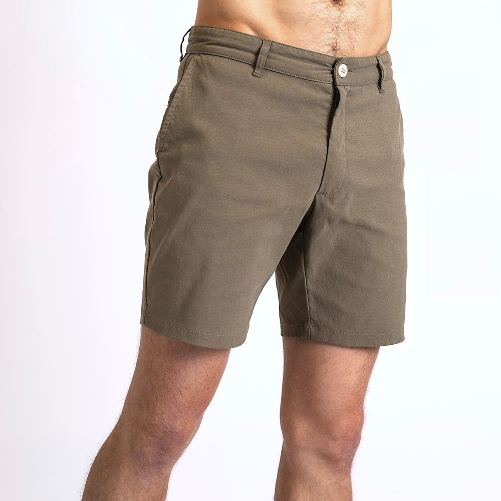 Side view of a man in the Shorts by åäö in Dusty Desert, showcasing their perfected design and timeless fit.