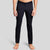 Front view of a man in The Pants by åäö in Tech Black, showcasing their sleek design and tailored fit.